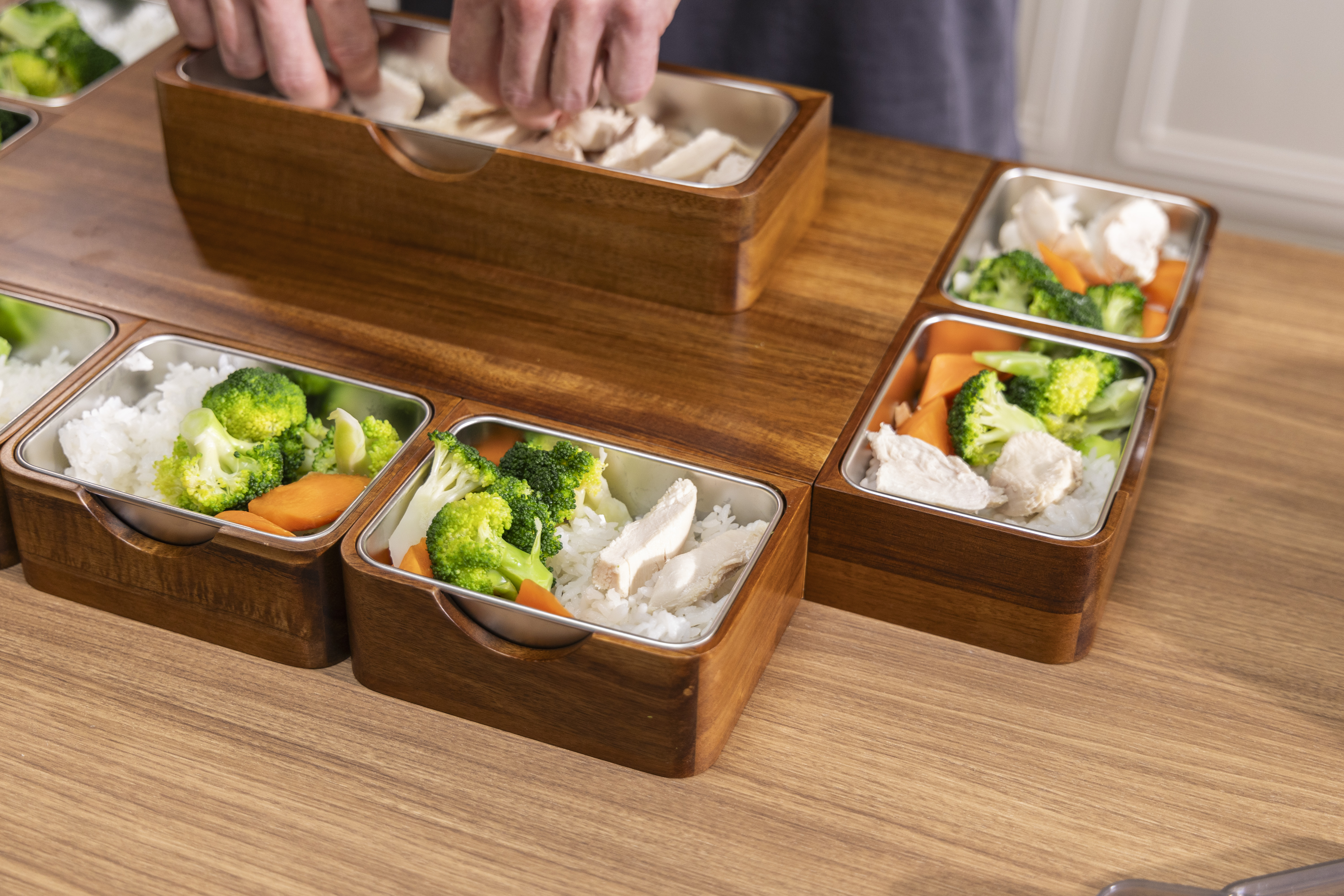 Prepared portions of food arranged across PrepTop modules